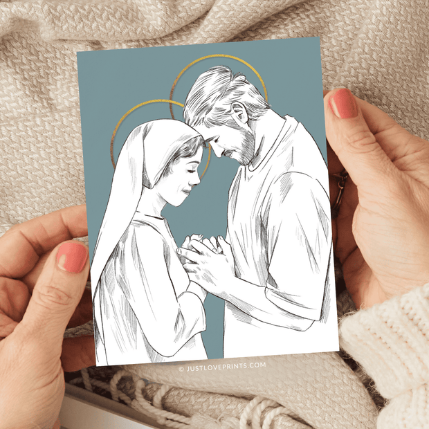 Illustration of Mary and Joseph, depicted with halos, tenderly holding hands and gazing at each other, set against a blue background with artistic details.