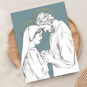Illustration of Mary and Joseph, depicted with halos, tenderly holding hands and gazing at each other, set against a blue background with artistic details.