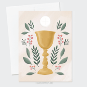 Golden Chalice and Host on a pink background with floral decorations