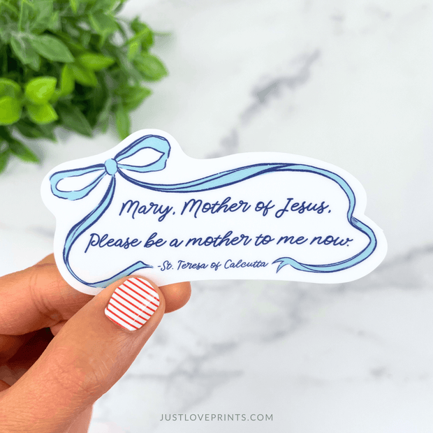 Vinyl sticker with a blue ribbon design and the prayer “Mary, Mother of Jesus, please be a mother to me now.”