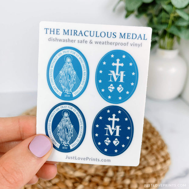 Miraculous medal sticker sheet features two light blue and two dark blue stickers, two of the front and two of the back