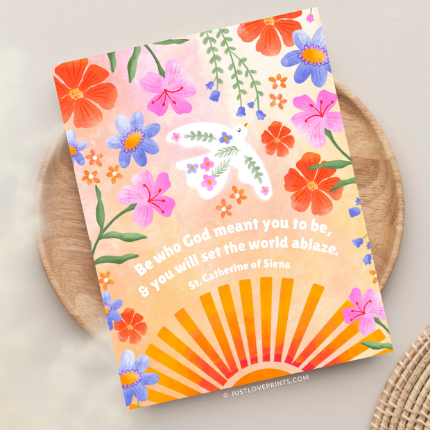 Greeting card with colorful flowers, sun rays, and quote from St. Catherine of Siena: “Be who God meant you to be, and you will set the world ablaze.”