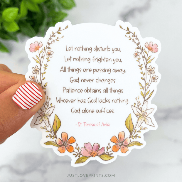Floral vinyl sticker with St. Teresa of Avila’s prayer text, surrounded by pink and orange flowers.