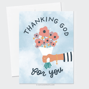 An illustrated card with the text "thanking god for you" features a hand holding a bouquet of colorful flowers and a rosary, set against a light blue background with a watercolor effect.