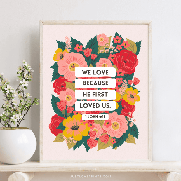 We love because He first loved us 1 John 4:19 floral Christian wall art print with red, pink, and yellow flowers