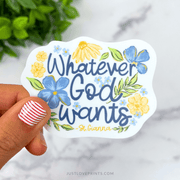 Vinyl sticker with the words “Whatever God Wants – St. Gianna” in script surrounded by blue and yellow flowers.