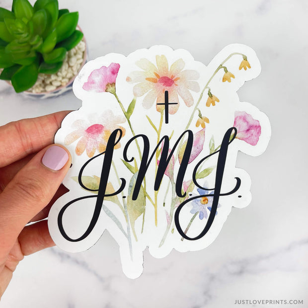 Floral background with letters JMJ and cross. 