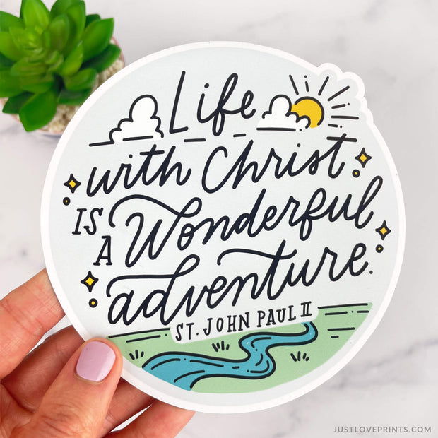 River, green grass and sunshine with quote life with christ is a wonderful adventure - st john paul ii