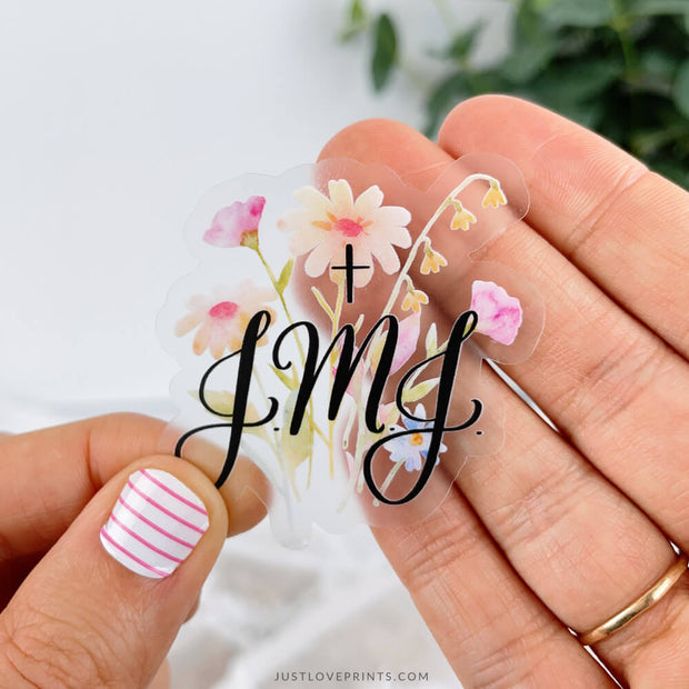 Colorful floral sticker on a clear background with JMJ.