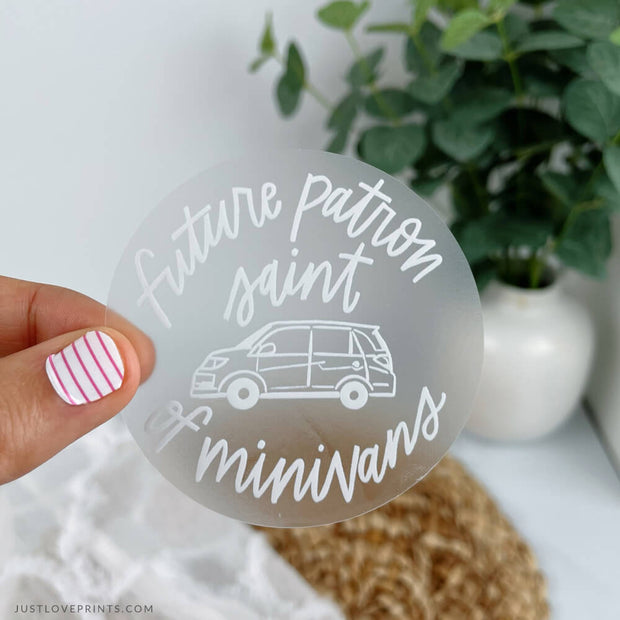 Clear vinyl sticker that reads "future patron saint of minivans" with a minivan. 
