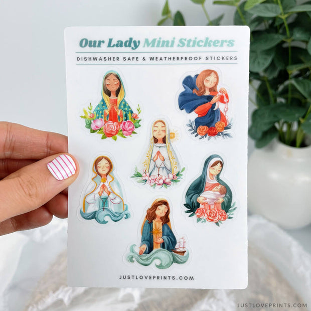 this sticker sheet features 6 different images of Mary: our lady of Guadalupe, our Lady Undoer of Knots, Stella Maris, Our Lady of Fatima, Our Lady of Le Leche, and Our Lady of Lourdes. 